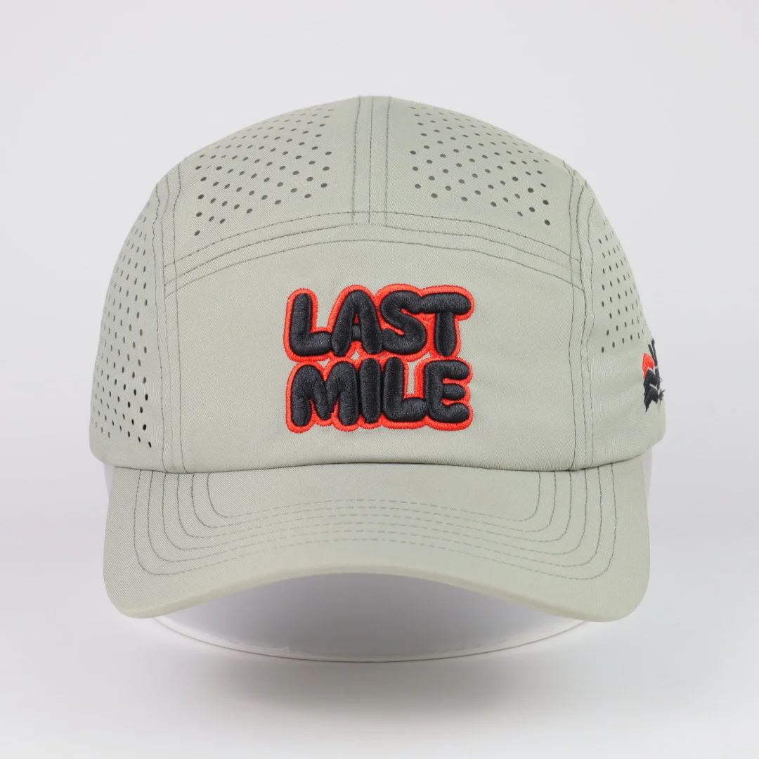 Sage green performance cap with a perforated crown, front embroidery and curved brim