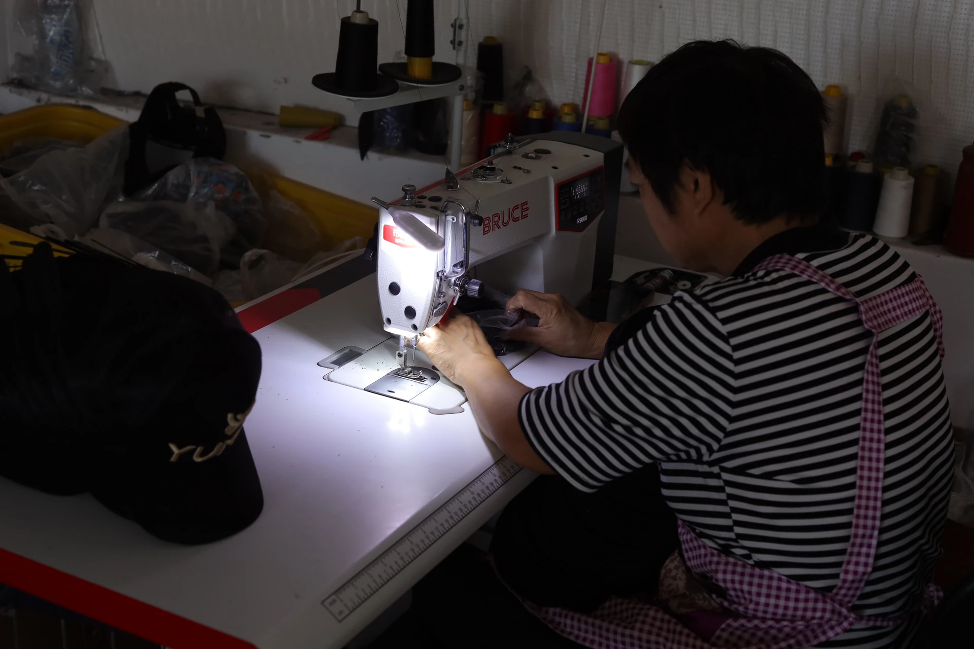 Industrial machine sewing custom cap fabric components