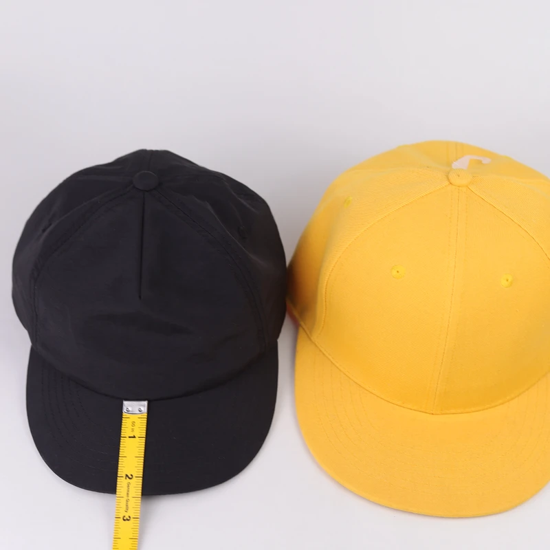 Finished short-brim cap peak measured on a physical sample