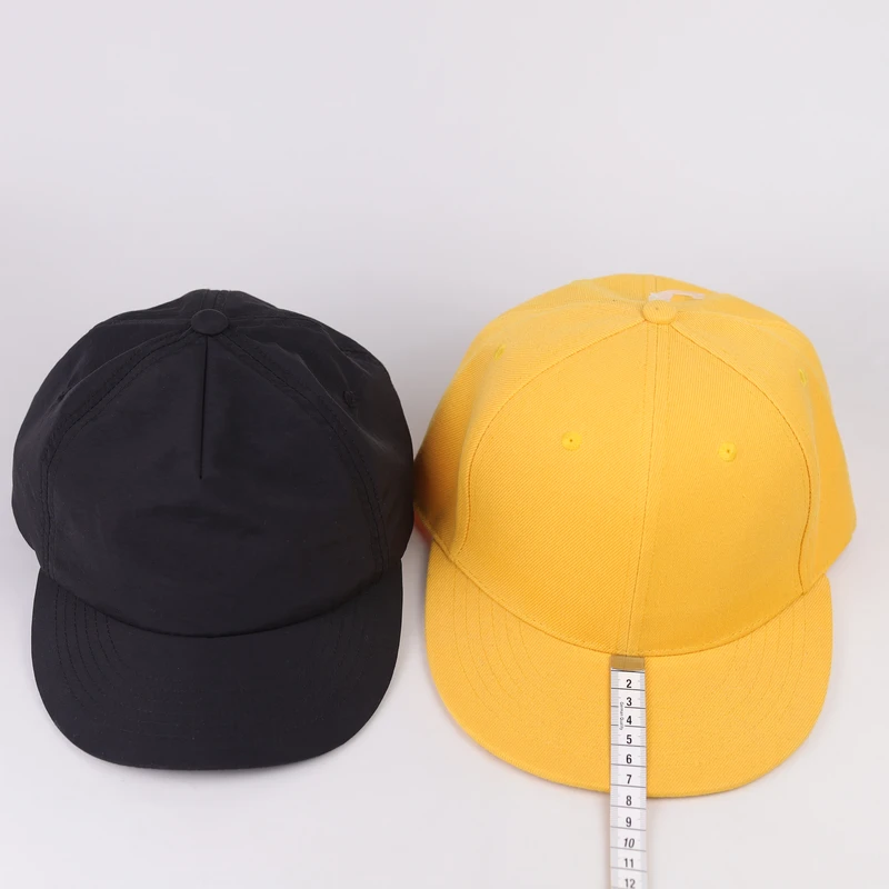 Front comparison between a short-brim low-profile cap and a standard 6-panel cap