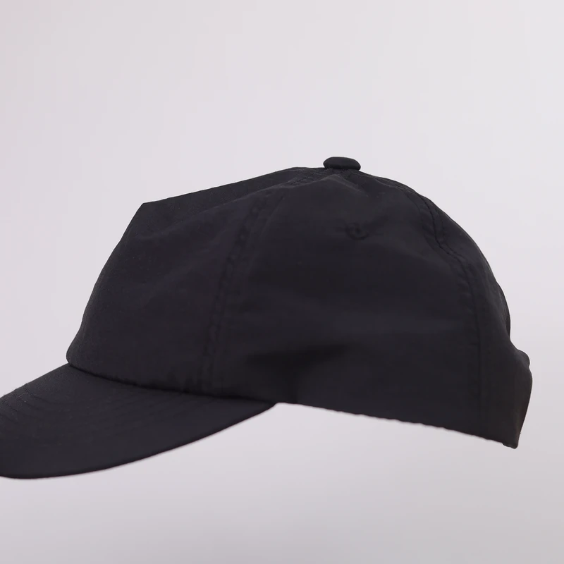 Short brim cap side profile showing crown and visor projection