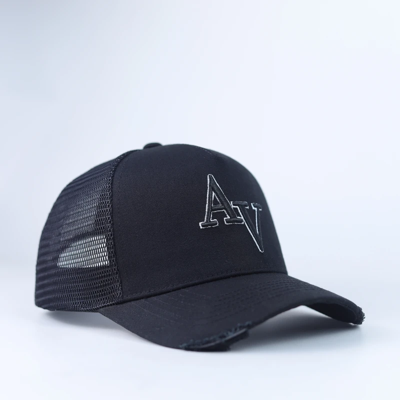 Black trucker cap with white outline embroidered logo and black mesh back